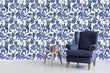 Load image into Gallery viewer, Blue cat and flower toile fabric peel and stick wallpaper with a blue chair and table
