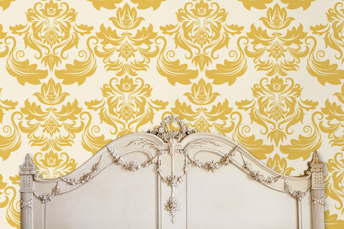 Antique Victorian gold damask fabric peel and stick wallpaper in room with antique bed