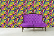 Load image into Gallery viewer, Bold colorful neon vintage tropical fabric peel and stick wallpaper with vintage purple sofa
