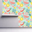 Load image into Gallery viewer, Tropical summer fruit fabric peel and stick wallpaper on wall partially rolled up
