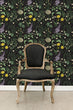 Load image into Gallery viewer, Cottagecore botanical floral dark fabric peel and stick wallpaper with black chair
