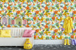 Load image into Gallery viewer, Orange and yellow vintage retro tropical butterfly garden fabric peel and stick wallpaper in kid&#39;s room with bench and clothing
