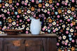 Load image into Gallery viewer, Dark flower garden fabric peel and stick wallpaper with cabinet, water pitcher and bowl
