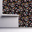 Load image into Gallery viewer, Dark flower garden fabric peel and stick wallpaper on wall partially rolled up
