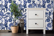 Load image into Gallery viewer, Blue cat and flower toile fabric peel and stick wallpaper with nightstand, cat and plant
