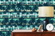 Load image into Gallery viewer, Blue coastal tropical palm trees fabric peel and stick wallpaper with cabinet, lamp and clock
