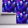 Load image into Gallery viewer, Blue moody tropical nautical jellyfish fabric peel and stick wallpaper on wall partially rolled up

