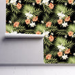Load image into Gallery viewer, Pink and black dark tropical coastal palm fabric peel and stick wallpaper on wall partially rolled up
