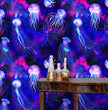 Load image into Gallery viewer, Blue moody tropical nautical jellyfish fabric peel and stick wallpaper with table and gold jars

