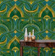 Load image into Gallery viewer, Blue, green and gold geometric Art Nouveau fabric wallpaper with table and gold bottles
