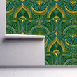 Load image into Gallery viewer, Blue, green and gold geometric Art Nouveau fabric wallpaper on wall partially rolled up
