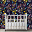 Load image into Gallery viewer, Blue and purple botanical floral hummingbird fabric peel and stick wallpaper in nursery with crib
