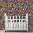 Load image into Gallery viewer, Dark floral botanical fabric peel and stick wallpaper with baby crib
