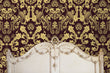 Load image into Gallery viewer, Ornate gold damask Victorian fabric peel and stick wallpaper with antique bed
