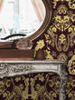 Load image into Gallery viewer, Ornate gold damask Victorian fabric peel and stick wallpaper with table and mirror
