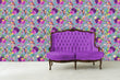 Load image into Gallery viewer, Purple and blue botanical floral hummingbird fabric peel and stick wallpaper with purple sofa
