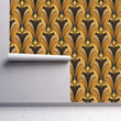 Load image into Gallery viewer, Gold and brown antique geometric Art Deco fabric peel and stick wallpaper on wall partially rolled up
