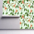 Load image into Gallery viewer, Vintage antique botanical floral fabric peel and stick wallpaper on wall partially rolled up
