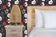 Load image into Gallery viewer, Victorian antique dark floral fabric peel and stick wallpaper with bed, side table and lamp
