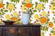 Load image into Gallery viewer, Orange vintage antique Victorian cottage floral fabric peel and stick wallpaper with cabinet and water pitcher
