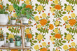 Load image into Gallery viewer, Orange vintage antique Victorian cottage floral fabric peel and stick wallpaper with plant stand and plants
