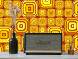 Load image into Gallery viewer, Orange vintage retro bold geometric fabric peel and stick wallpaper with vintage radio and vase
