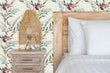 Load image into Gallery viewer, Purple lavender antique vintage cottage botanical fabric peel and stick wallpaper in bedroom with bed and end table with lamp
