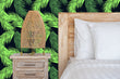 Load image into Gallery viewer, Neon green tropical palm leaves fabric peel and stick wallpaper with bed and lamp
