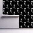 Load image into Gallery viewer, Black gothic skeleton mermaid cat fabric peel and stick wallpaper on wall partially rolled up
