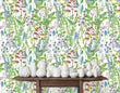 Load image into Gallery viewer, Green and blue wildflower garden cottage fabric peel and stick wallpaper with table and white vases
