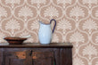 Load image into Gallery viewer, Pink Victorian antique damask fabric peel and stick wallpaper with cabinet, bowl and pitcher
