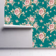 Load image into Gallery viewer, Pink and blue floral roses Victorian antique fabric peel and stick wallpaper on wall partially rolled up
