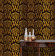 Load image into Gallery viewer, Black and gold Victorian gothic damask fabric peel and stick wallpaper with table and gold jars
