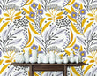 Load image into Gallery viewer, Yellow and grey botanical floral fabric peel and stick wallpaper with table and white vases

