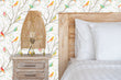 Load image into Gallery viewer, Colorful botanical bird fabric peel and stick wallpaper in bedroom with bed, night stand and lamp
