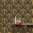 Load image into Gallery viewer, Black and gold vintage geometric Art Deco fabric peel and stick wallpaper with table and gold jars
