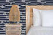 Load image into Gallery viewer, Blue and white nautical rope and knots fabric peel and stick wallpaper with bed, nightstand and lamp
