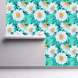 Load image into Gallery viewer, Blue and white floral daisy cottage fabric peel and stick wallpaper on wall partially rolled up
