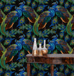 Load image into Gallery viewer, Black and blue dark topical botanical peacock fabric peel and stick wallpaper with table and gold jars
