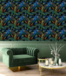 Load image into Gallery viewer, Black and blue dark topical botanical peacock fabric peel and stick wallpaper with green chair and coffee table
