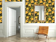 Load image into Gallery viewer, Yellow lily floral botanical fabric peel and stick wallpaper with chair and mirror
