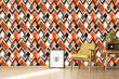 Load image into Gallery viewer, Orange and brown geometric retro Mid-century modern fabric peel and stick wallpaper with vintage radio, table, chair and picture of a bee
