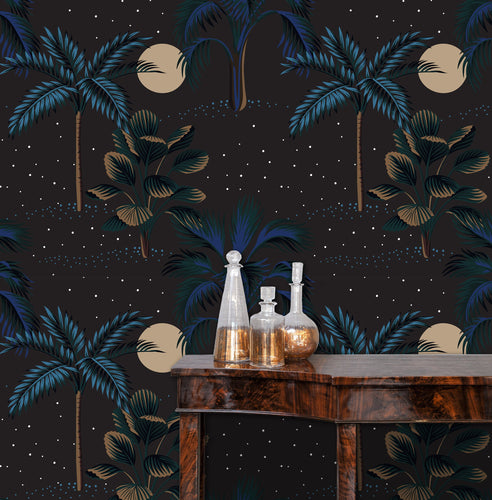 Dark tropical peel and stick wallpaper with side table and gold accent bottles