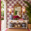 Load image into Gallery viewer, Reese Way wallpaper by Pickwick &amp; Elm in a Palm Beach entryway with a bamboo mirror, blue and white ginger jars, tropical plants, and a white console table.
