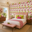 Load image into Gallery viewer, A blush upholstered bed is paired with Pickwick &amp; Elm's Stella Road wallpaper, creating a vibrant Palm Springs-inspired bedroom with bold mid-century modern charm.
