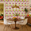 Load image into Gallery viewer, Mid-century modern dining room featuring Stella Road wallpaper by Pickwick &amp; Elm, a walnut tulip table, white molded chairs, and colorful retro-inspired décor.
