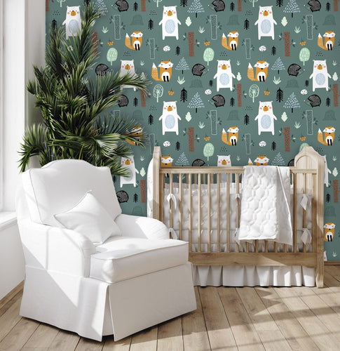 Blue woodland animals boy room peel and stick wallpaper in nursery with crib and chair