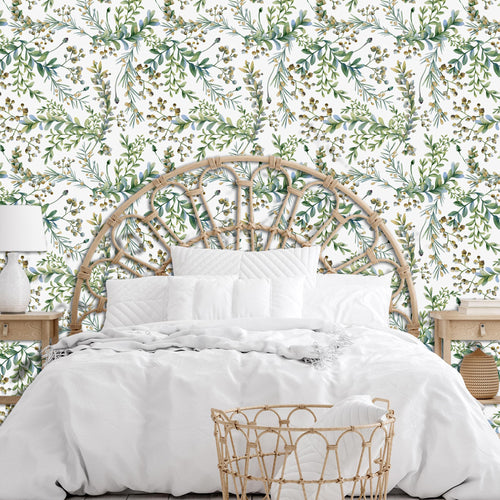Botanical watercolor peel and stick wallpaper on wall with bed