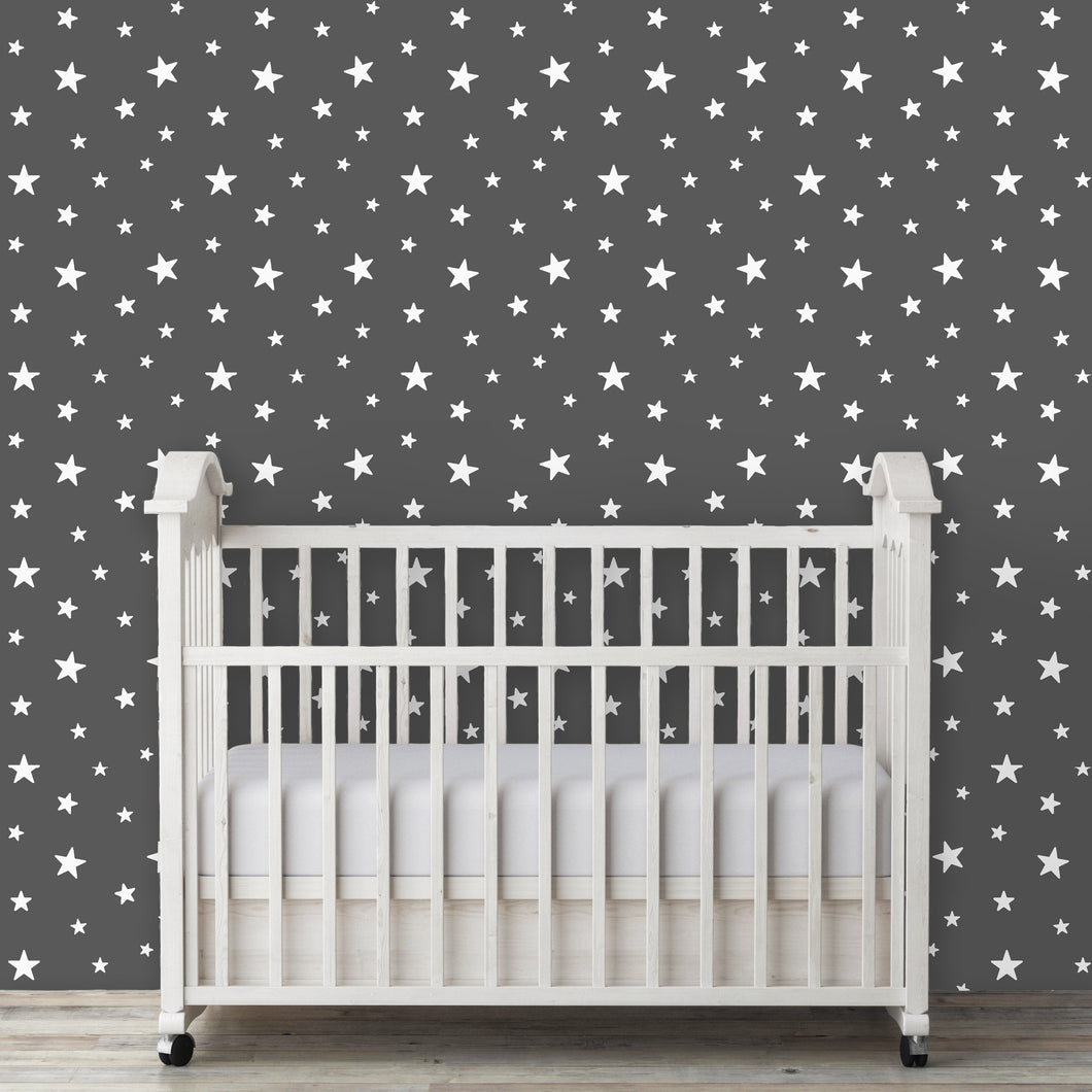 Kids room grey star peel and stick wallpaper with baby crib