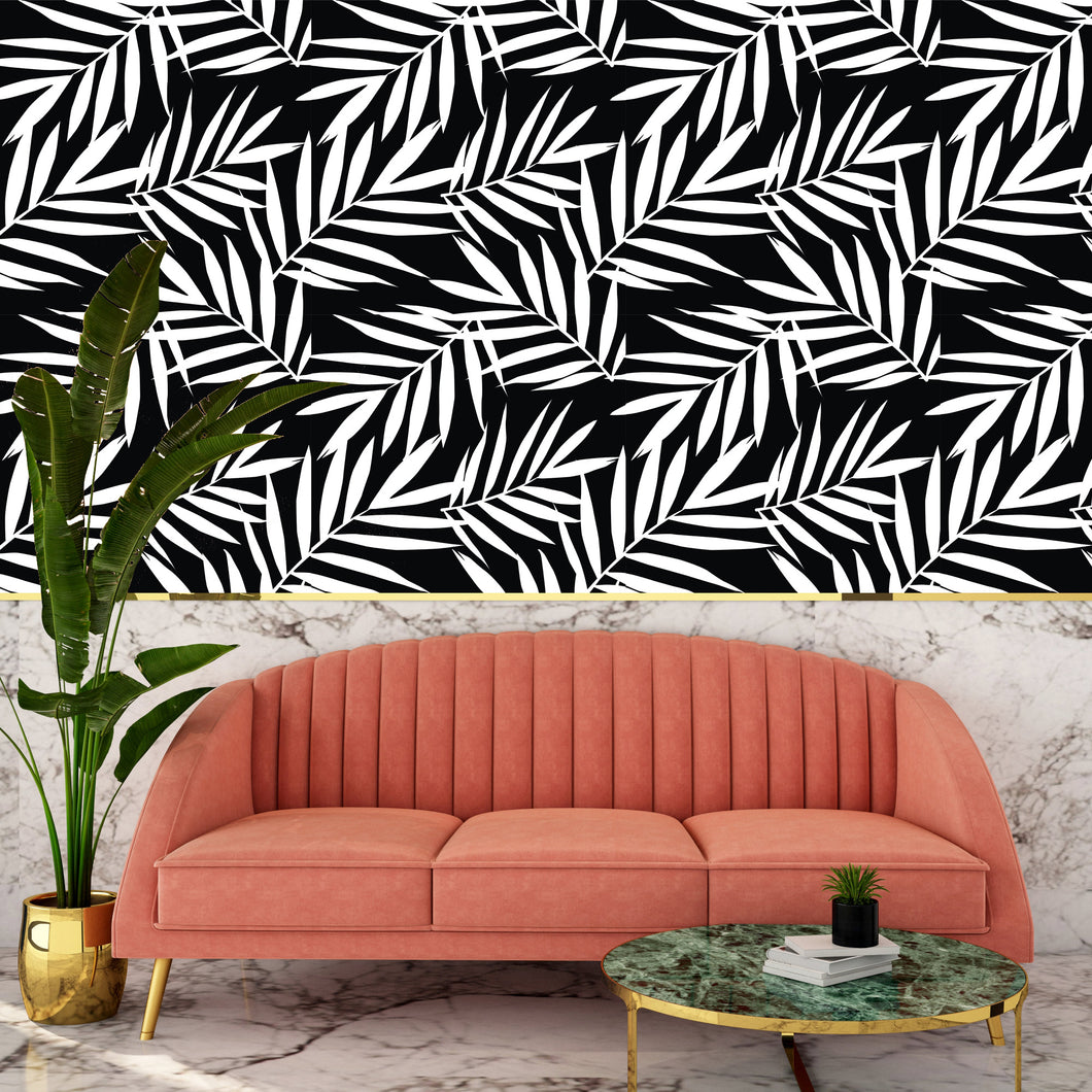 Black and white tropical palm fabric peel and stick wallpaper with sofa and coffee table